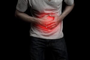 Cyclic Vomiting Syndrome - Man hand touching stomach ache and pain illness