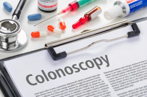 text Colonoscopy written on a clipboard - colon cancer screening