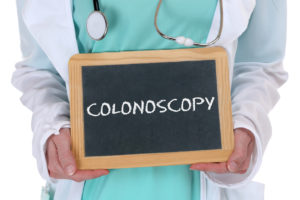 Colonoscopy cancer prevention screening check-up disease ill illness doctor with sign
