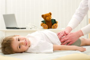 gastroenterologist examining child Patient