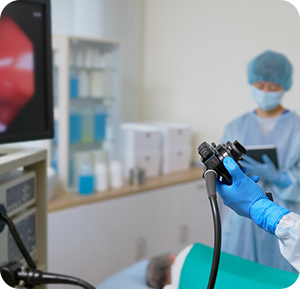 Colonoscopy doctors performing a colonoscopy procedure on a patient.