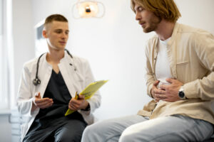 A male patient experiencing constipation has an appointment with a gastroenterologist.