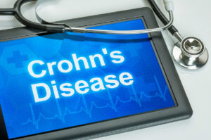 Tablet with the diagnosis Crohn's disease on the display.